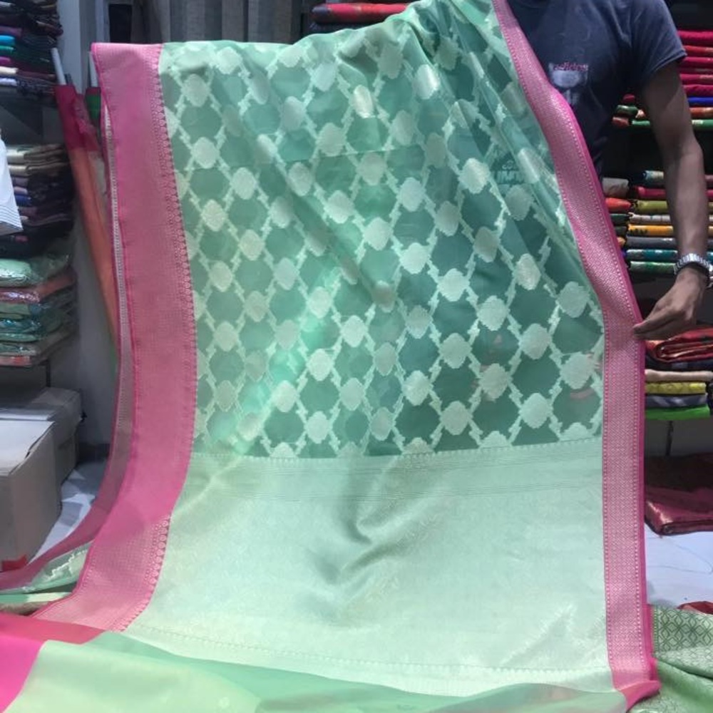 Benarasi mint green with pink border saree